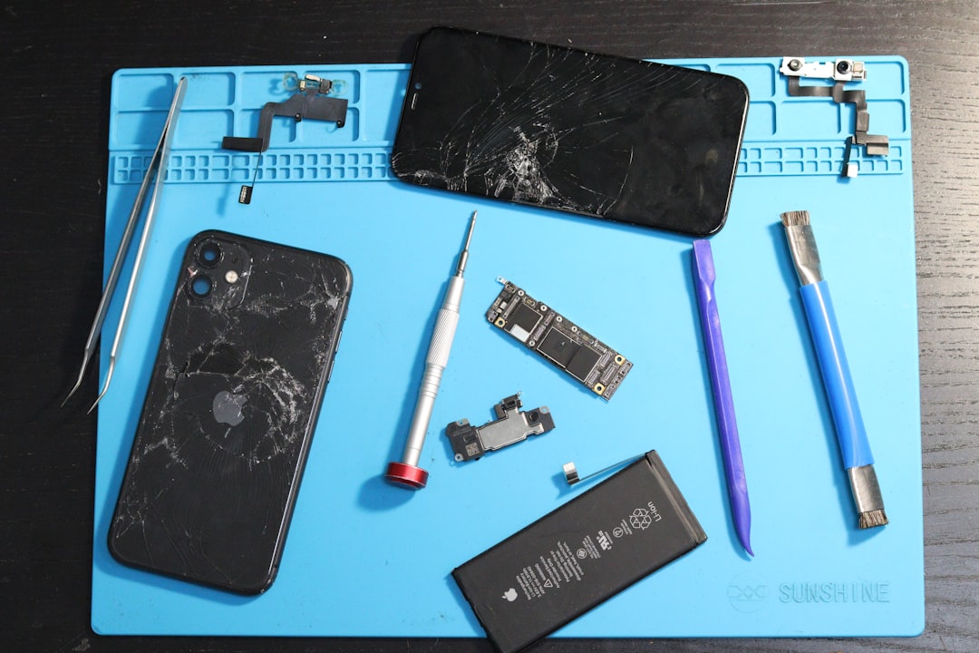 Phone components are laid out for repair.